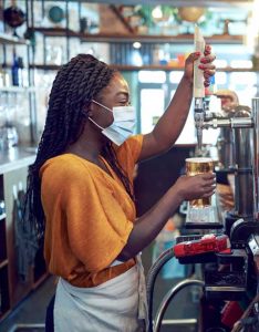 Women Pouring Lager Beer